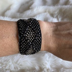 Black and silver beaded cuff bracelet with snap closure